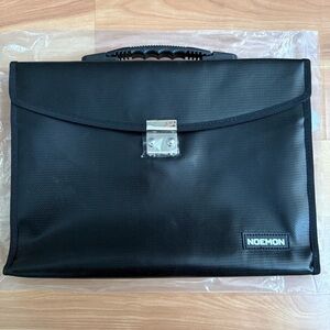 Noemon Black Briefcase Bag – New, 25 Pockets, Never Used
